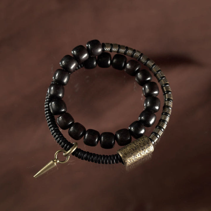 Braccialetto di equilibrio a doppio giro con perline vintage in legno di ebano, ottone e rame Buddha Stones