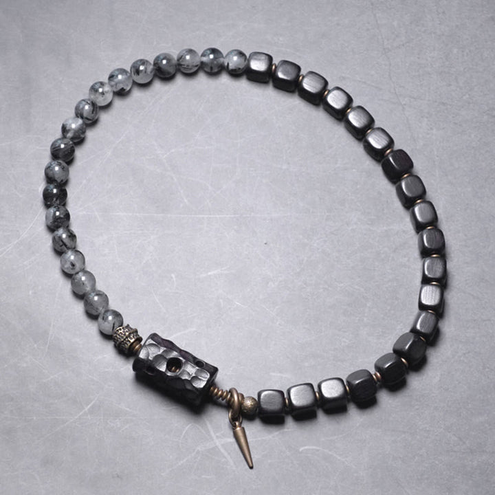 Braccialetto con bilanciere a doppio giro in ottone e rame, in legno di ebano e quarzo rutilato nero Buddha Stones