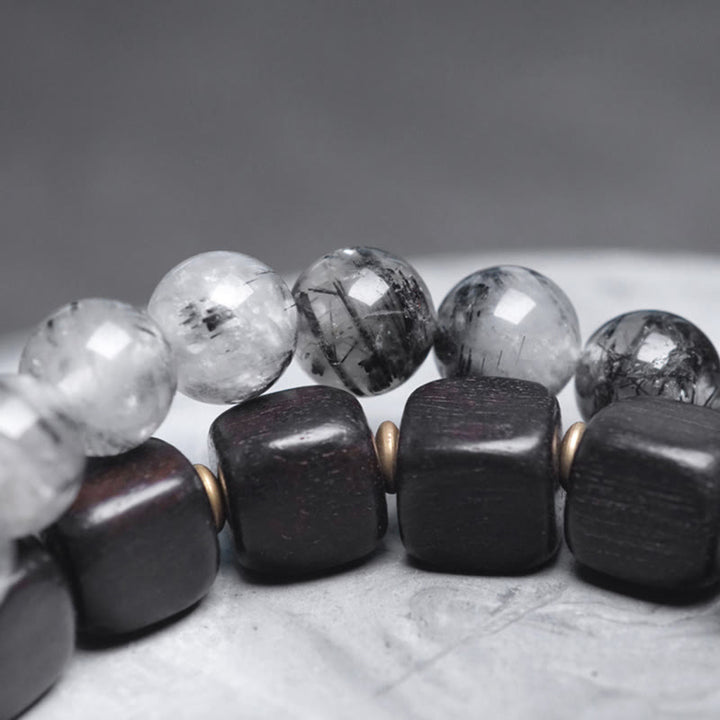 Braccialetto con bilanciere a doppio giro in ottone e rame, in legno di ebano e quarzo rutilato nero Buddha Stones