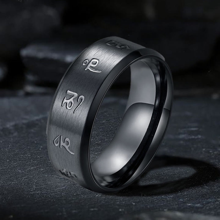 Anello di equilibrio in acciaio al titanio con mantra Jambhala nero Buddha Stones