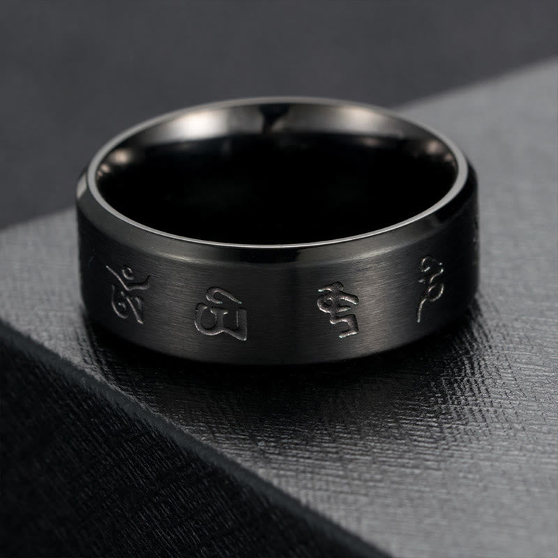 Anello di equilibrio in acciaio al titanio con mantra Jambhala nero Buddha Stones