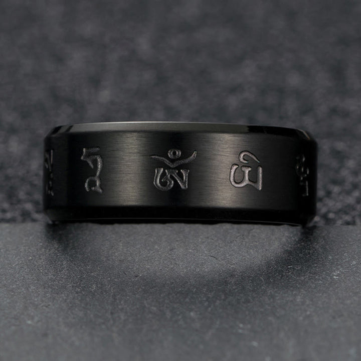 Anello di equilibrio in acciaio al titanio con mantra Jambhala nero Buddha Stones