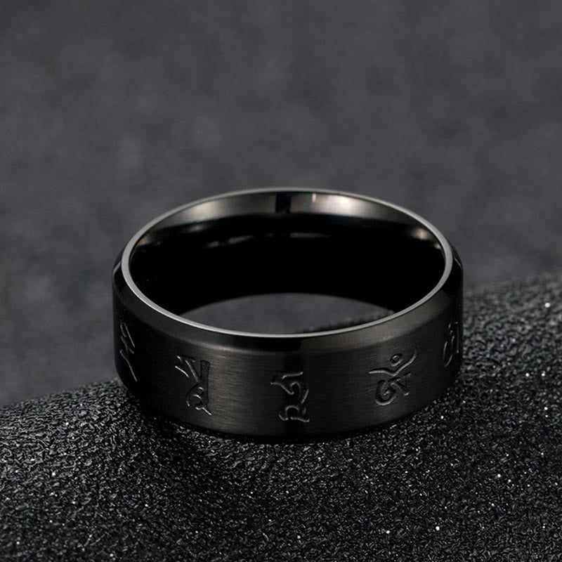 Anello di equilibrio in acciaio al titanio con mantra Jambhala nero Buddha Stones