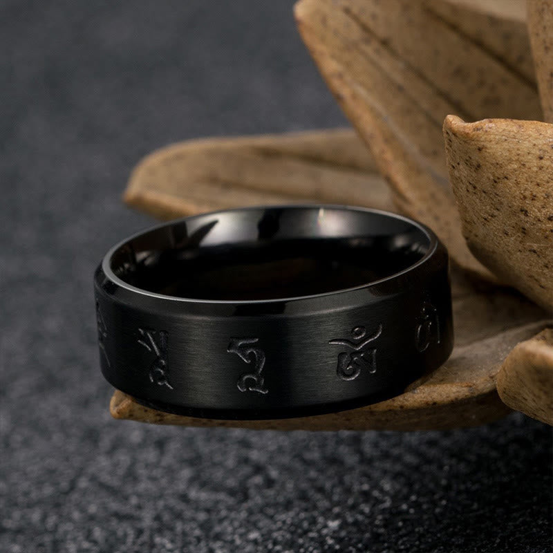 Anello di equilibrio in acciaio al titanio con mantra Jambhala nero Buddha Stones