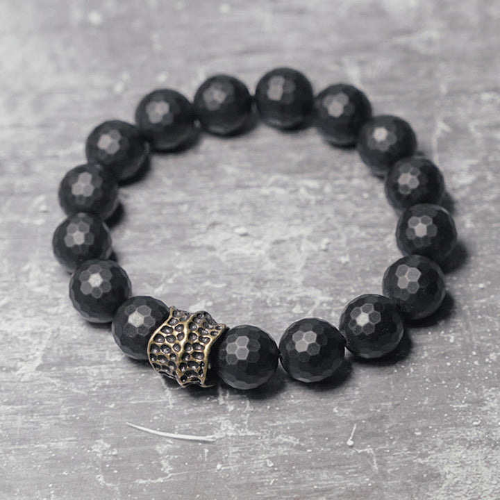 Braccialetto di protezione in ottone e rame con onice nero opaco Buddha Stones