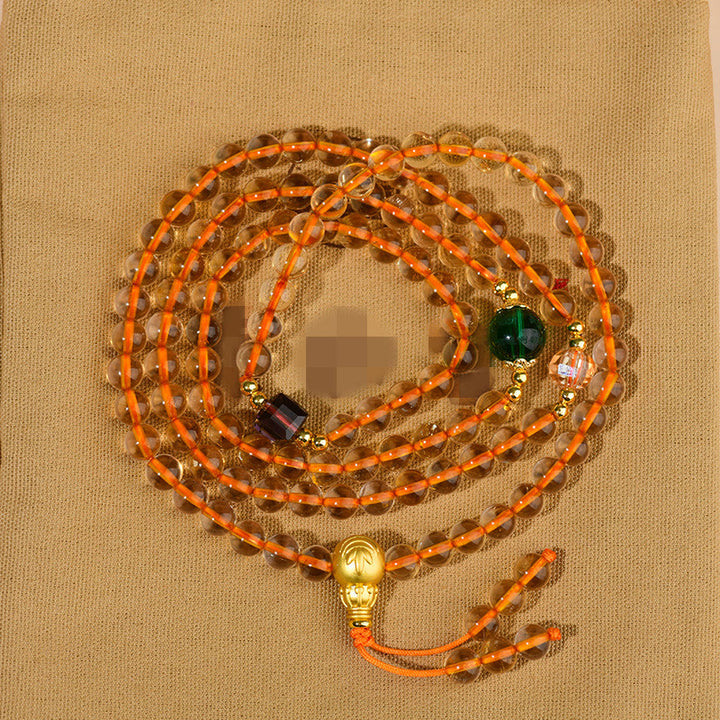 Braccialetto della felicità con 108 perle di Mala in citrino Buddha Stones