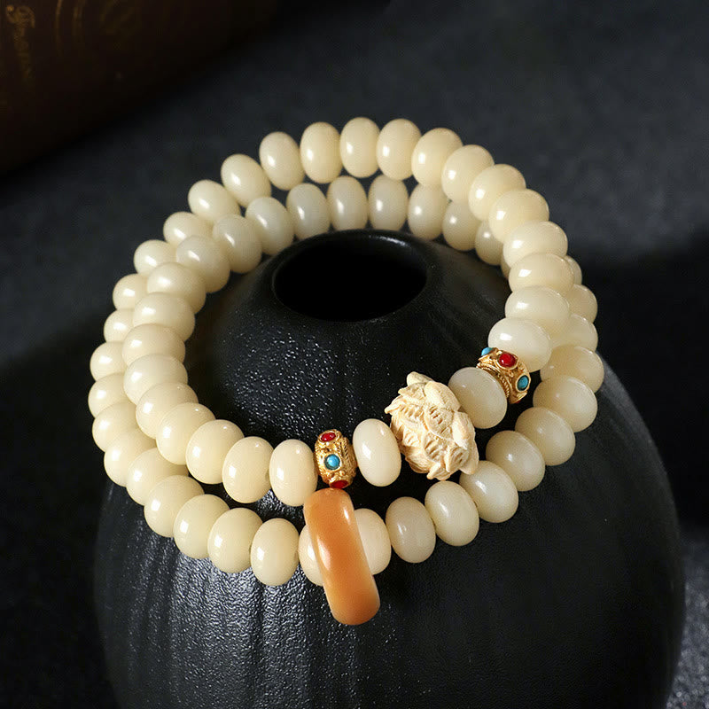 Braccialetto doppio giro Buddha Stones Bodhi Seed Peach Wood Lotus Wealth