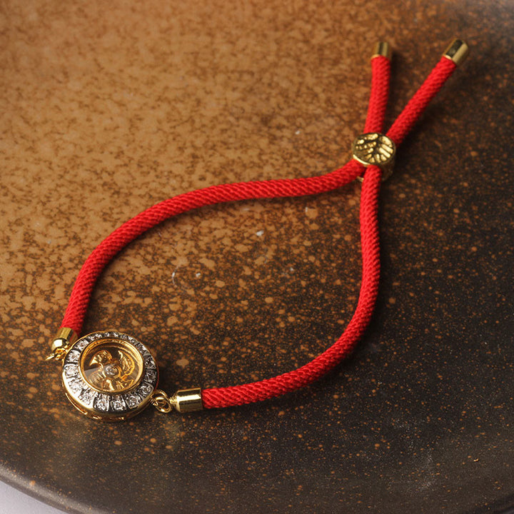 Buddha Stones Rame Ottone Feng Sheng Shui Qi Mulino a vento girevole Braccialetto intrecciato con corda rossa Fede