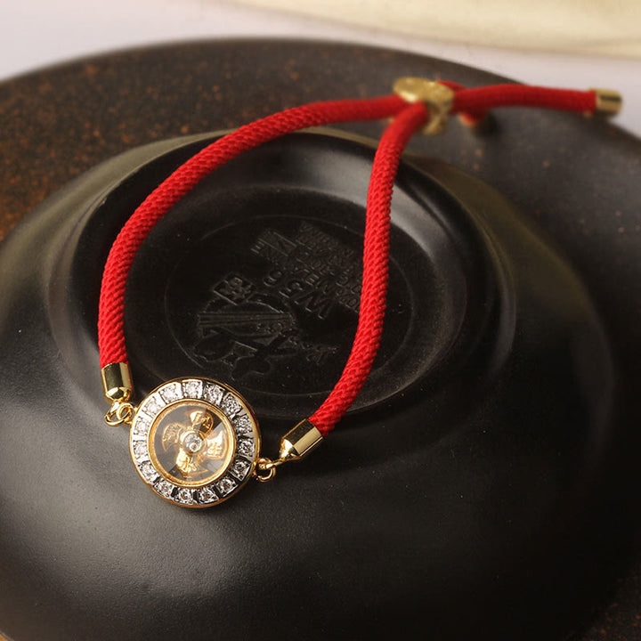 Buddha Stones Rame Ottone Feng Sheng Shui Qi Mulino a vento girevole Braccialetto intrecciato con corda rossa Fede