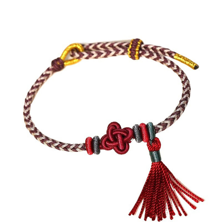 Braccialetto di protezione con nappe con nodo in fiore di pesco e Buddha Stones colorate