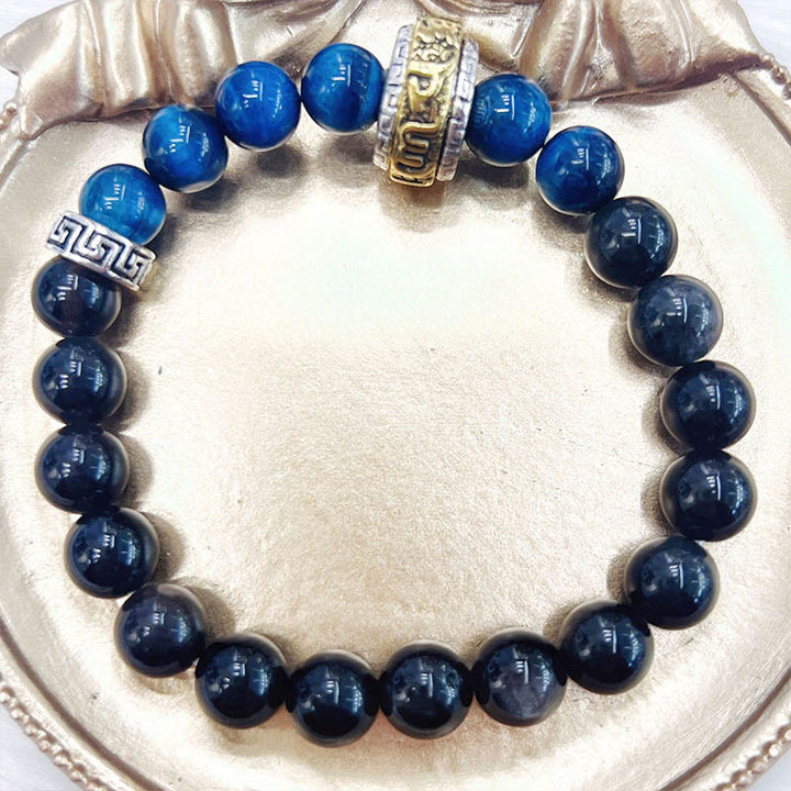 Braccialetto di protezione in occhio di tigre blu ossidiana e argento lucido Buddha Stones