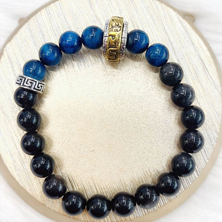 Braccialetto di protezione in occhio di tigre blu ossidiana e argento lucido Buddha Stones