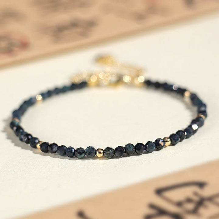 Braccialetto della saggezza con perle di rame, tormalina e indicolite Buddha Stones