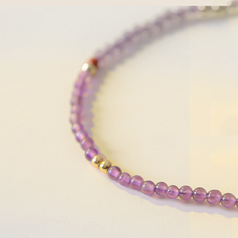 Braccialetto di meditazione per la pace interiore in rame placcato oro 14k con perline ultrasottili da 2 mm Buddha Stones Ametista naturale