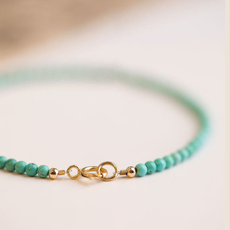 Braccialetto della saggezza in rame placcato oro 14k con perline ultrasottili color turchese da 2 mm Buddha Stones