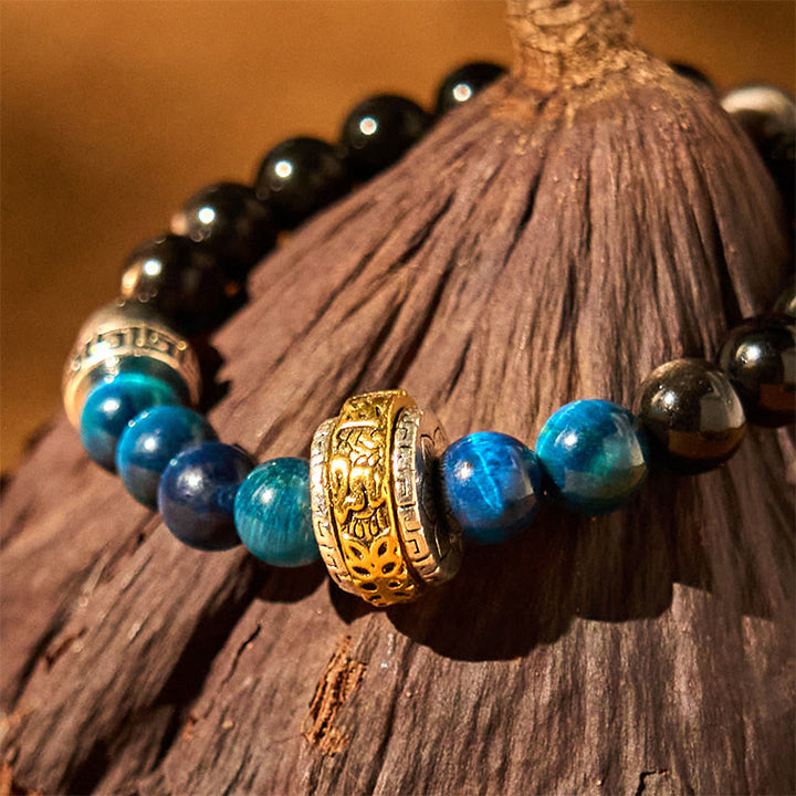 Braccialetto di protezione in occhio di tigre blu ossidiana e argento lucido Buddha Stones
