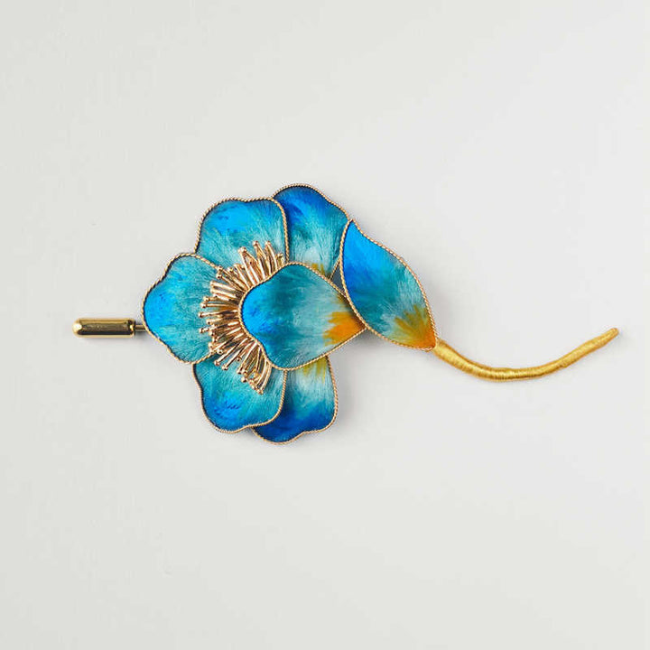 Spilla con fiore blu in seta di gelso e Buddha Stones, realizzata a mano