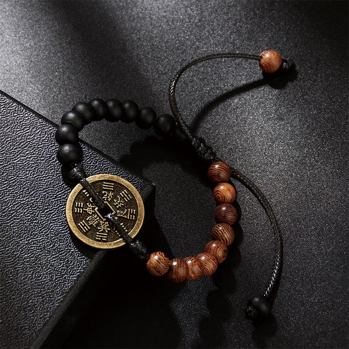 Buddha Stones Legno di ebano Legno di wenge Fantasmi di montagna Spendi soldi Bagua Moneta di rame Bracciale della pace