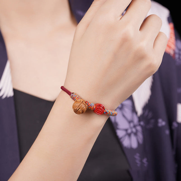 Braccialetto della fortuna fatto a mano con Buddha Stones, zodiaco cinese, filo rosso, nocciolo di pesca, cinabro