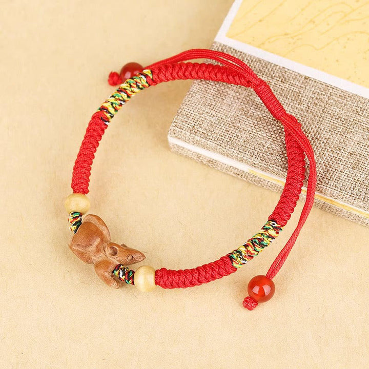 Braccialetto portafortuna in legno di pesca con corda rossa, fatto a mano, con zodiaco cinese di Buddha Stones