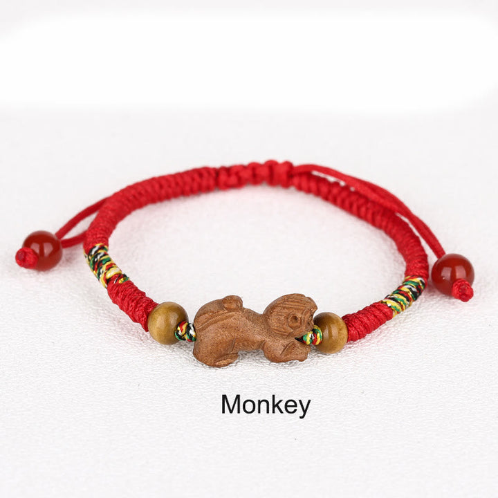 Braccialetto portafortuna in legno di pesca con corda rossa, fatto a mano, con zodiaco cinese di Buddha Stones