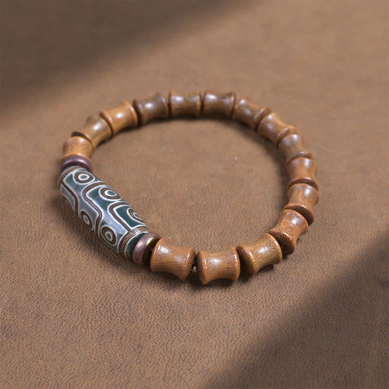 Braccialetto della pace in legno di sandalo verde con perline Dzi tibetane a nove occhi Buddha Stones