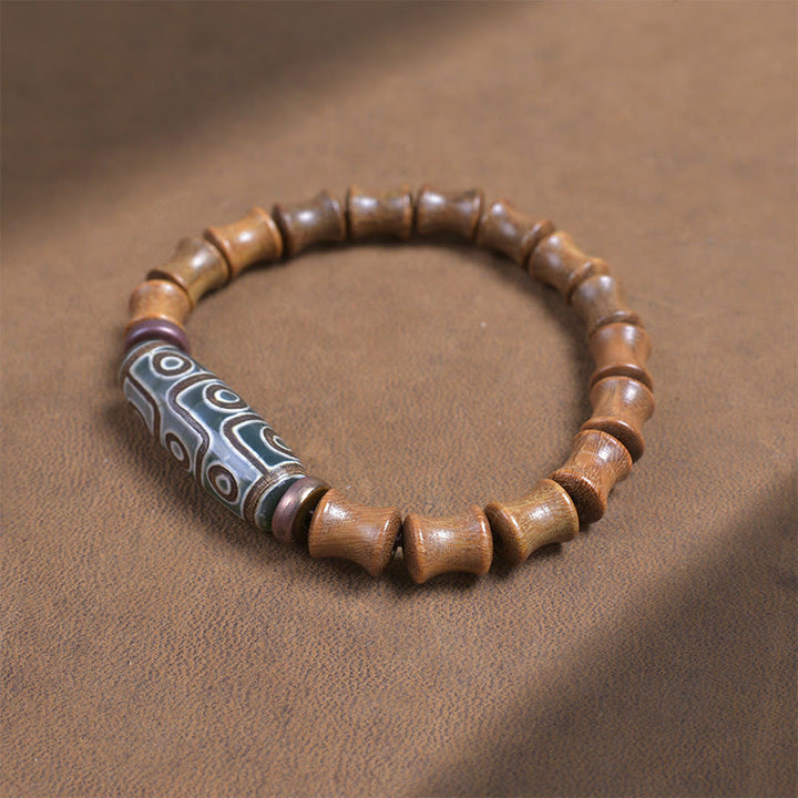Braccialetto della pace in legno di sandalo verde con perline Dzi tibetane a nove occhi Buddha Stones