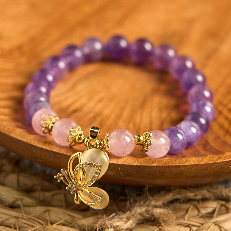 Braccialetto con ciondolo a farfalla in cristallo di quarzo fragola e ametista naturale Buddha Stones