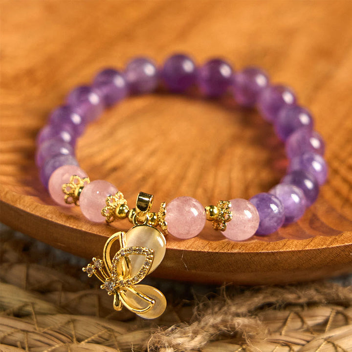 Braccialetto con ciondolo a farfalla in cristallo di quarzo fragola e ametista naturale Buddha Stones