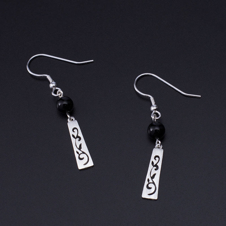 Orecchini pendenti con protezione a forma di vite cava in onice nero in argento sterling 925 Buddha Stones - image 3