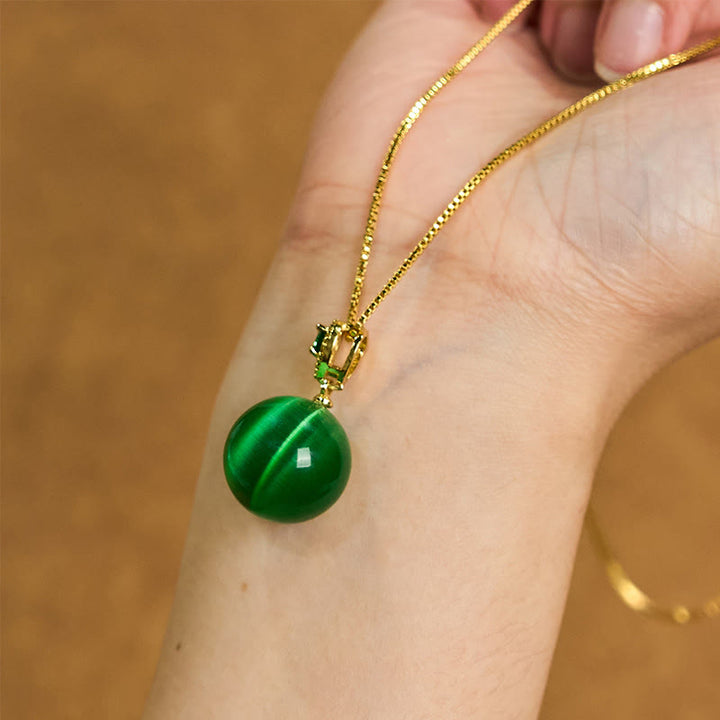 Buddha Stones Collana con ciondolo a forma di palla rotonda con occhio di gatto e simbolo di fiducia - image 18