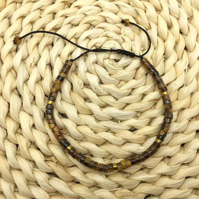 Braccialetto di perline distanziatrici in occhio di tigre naturale Buddha Stones