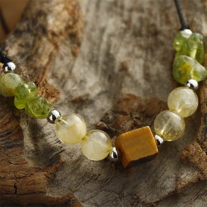 Buddha Stones Trova la tua gioia Braccialetto in corda della pace con peridoto, citrino, occhio di tigre
