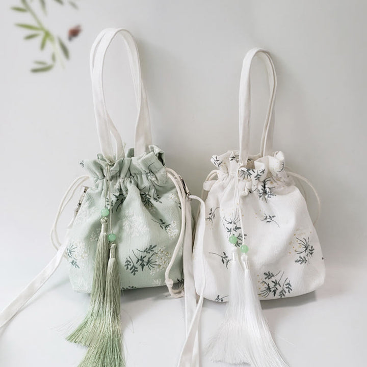 Borsa a tracolla in tela con fiori bianchi e foglie verdi, motivo Buddha Stones