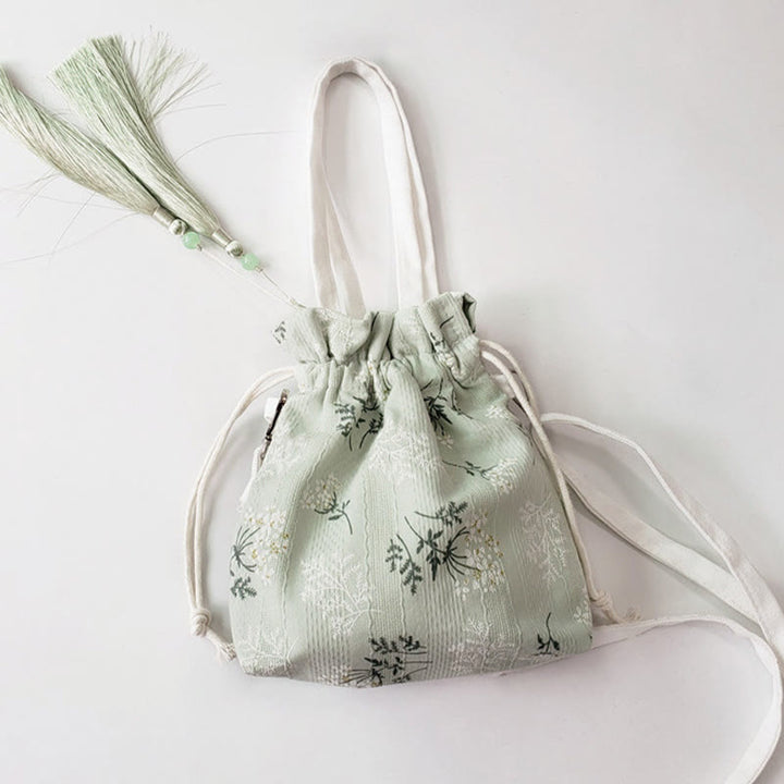 Borsa a tracolla in tela con fiori bianchi e foglie verdi, motivo Buddha Stones