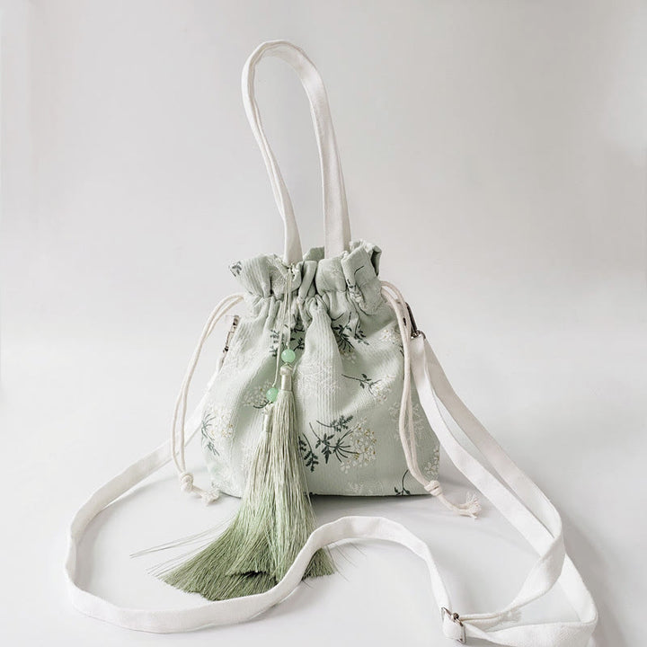 Borsa a tracolla in tela con fiori bianchi e foglie verdi, motivo Buddha Stones