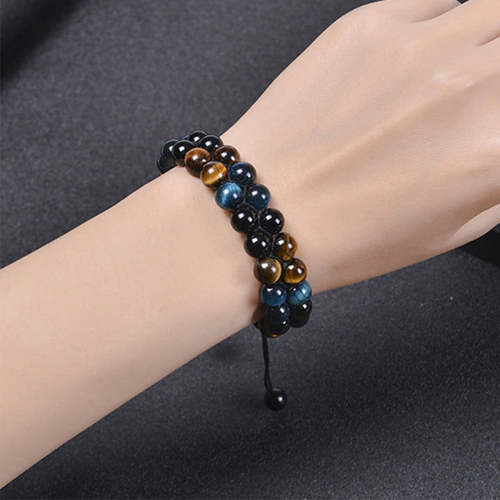 Braccialetto di forza con perline a doppia fila, motivo Om, in occhio di tigre blu naturale e magnetite nera con Buddha Stones
