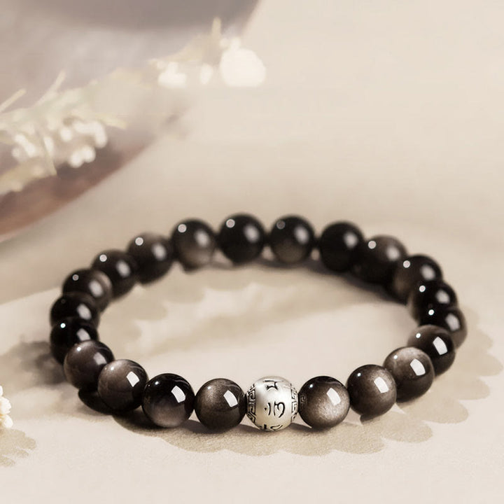 Bracciale di protezione Om Mani Padme Hum in ossidiana naturale lucida e argento Buddha Stones