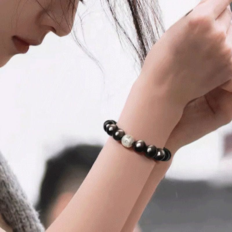 Bracciale di protezione Om Mani Padme Hum in ossidiana naturale lucida e argento Buddha Stones