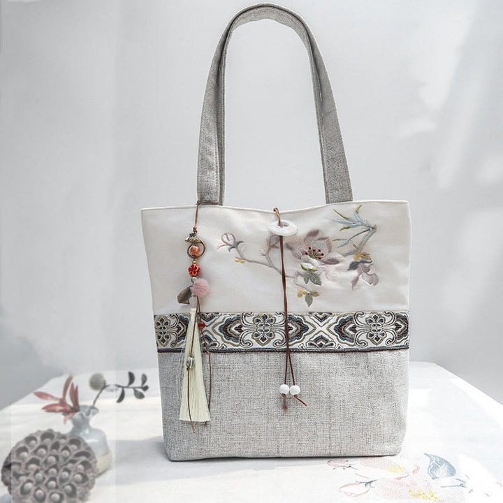 Borsa a tracolla in tela di poliestere con ricamo Buddha Stones Magnolia