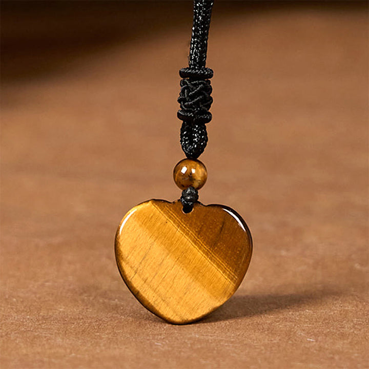 Collana con ciondolo in corda di protezione con motivo a cuore con occhio di tigre naturale Buddha Stones