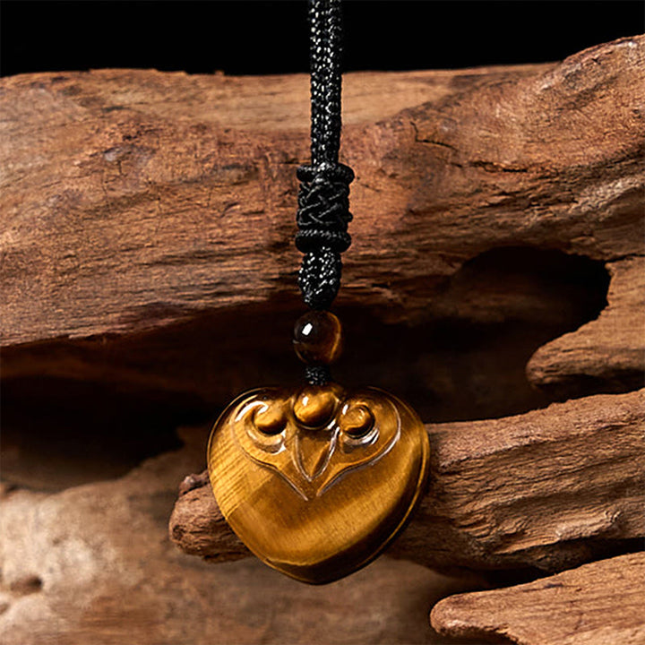 Collana con ciondolo in corda di protezione con motivo a cuore con occhio di tigre naturale Buddha Stones