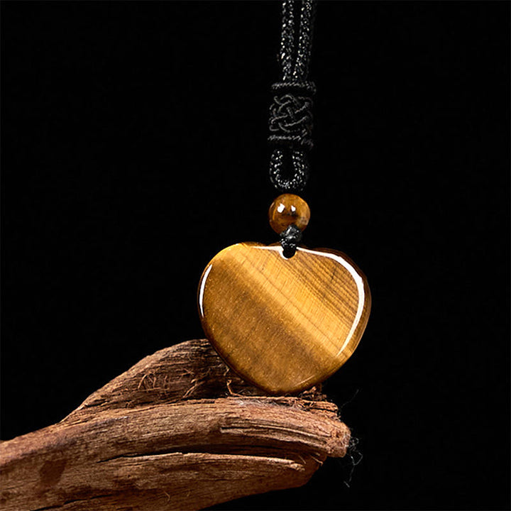 Collana con ciondolo in corda di protezione con motivo a cuore con occhio di tigre naturale Buddha Stones