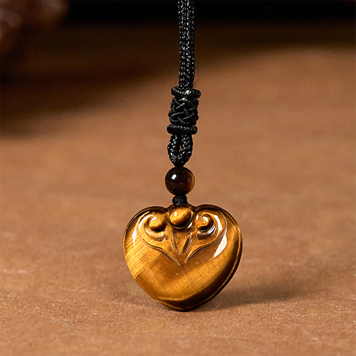 Collana con ciondolo in corda di protezione con motivo a cuore con occhio di tigre naturale Buddha Stones