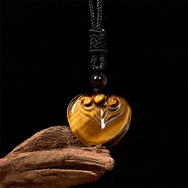 Collana con ciondolo in corda di protezione con motivo a cuore con occhio di tigre naturale Buddha Stones