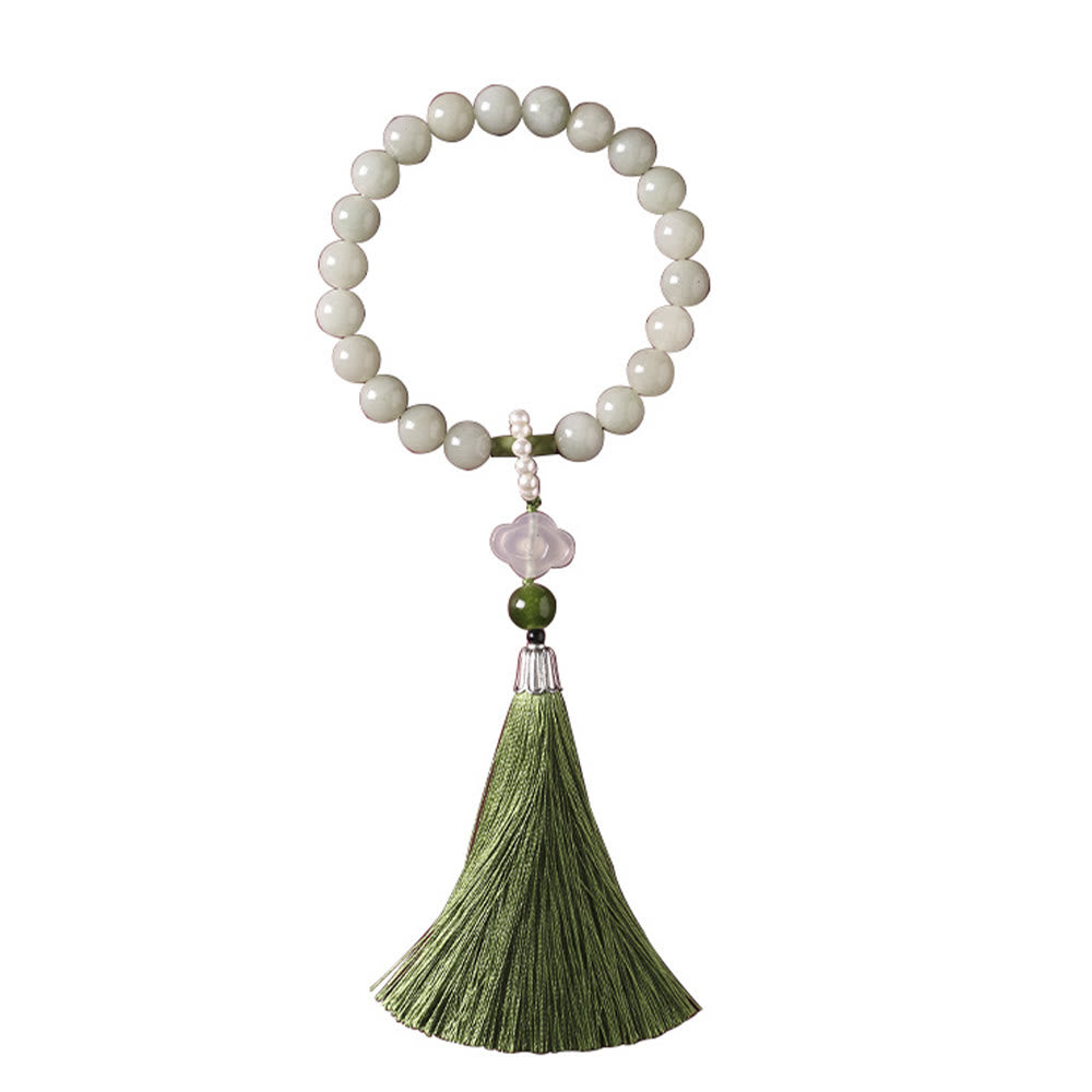 Mala da polso Buddha Stones, perle di giada verde e nappe di prosperità.