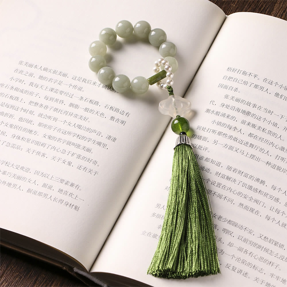 Mala da polso Buddha Stones, perle di giada verde e nappe di prosperità.