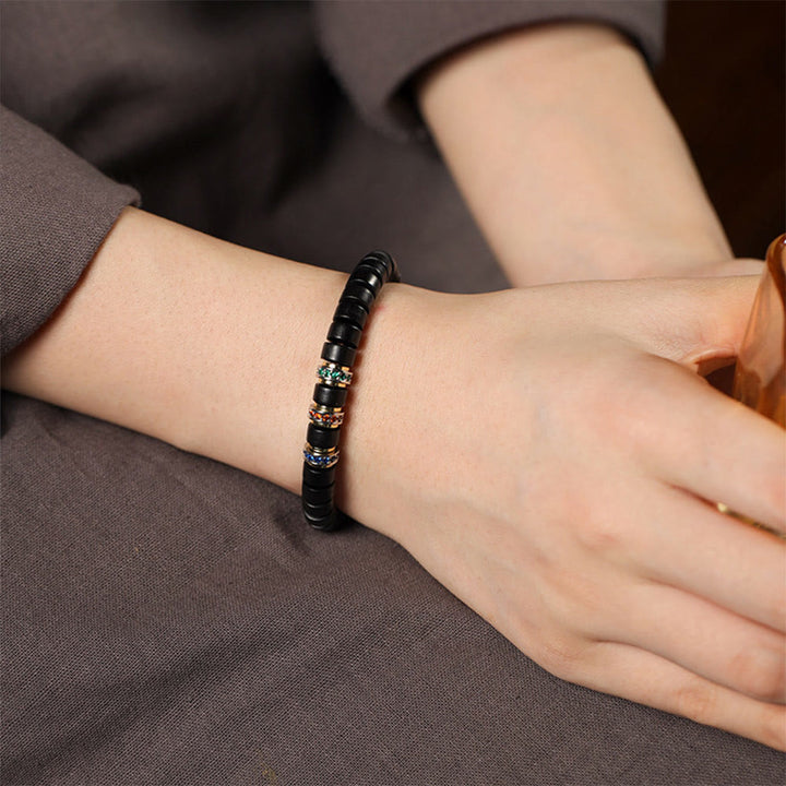 Bracciale della pace con zirconi, piccole foglie di sandalo rosso e Buddha Stones in legno di ebano