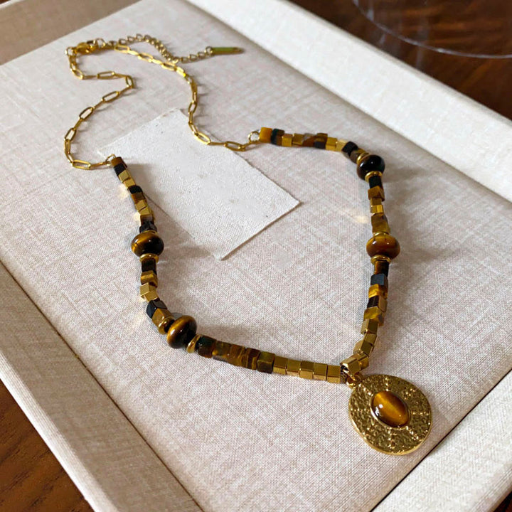 Collana con ciondolo in acciaio al titanio con protezione quadrata in occhio di tigre naturale Buddha Stones