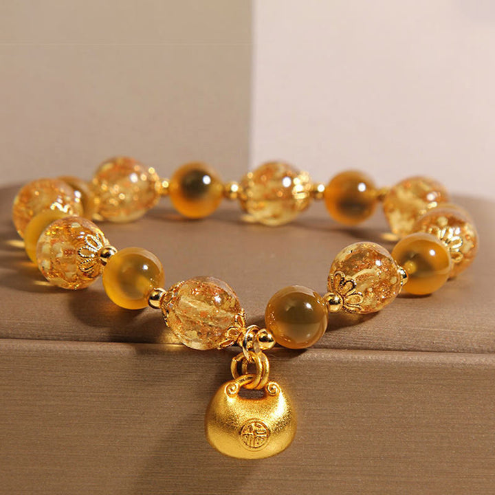 Braccialetto curativo con borsa della benedizione del carattere Fu in agata gialla caramellata Buddha Stones